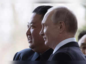 Russian President Vladimir Putin, right, and North Korea's leader Kim Jon...