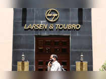 FILE PHOTO: A man walks past the Larsen and Toubro (L&T) head office in Mumbai