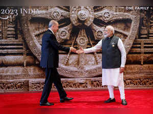 Turkey's President Recep Tayyip Erdogan (L) and India's Prime Minister Narendra Modi shake hands ahead of the G20 Leaders' Summit in New Delhi on September 9, 2023.