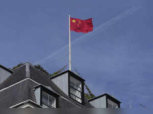 Chinese national flag is raised at the Chinese embassy in London. Prime Minister...