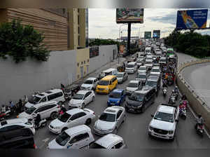 Motorists make their way along a road in Phnom Penh on September 12, 2023.