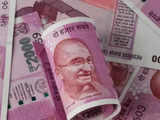 Rupee ends marginally down as traders await fresh triggers