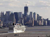 The 'Norwegian Jewel' sails past Lower Manhattan and One World Trade Center