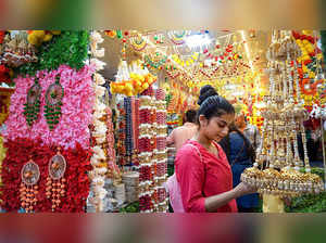 Thane: People shop for decorative items at a market ahead of 'Ganesh Chaturthi' ...