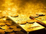 Gold hits 2-week high as dollar eases ahead of Fed meet