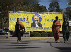 A photograph of late temple president Hardeep Singh Nijjar is seen on a banner o...