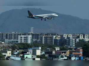A Vistara passenger aircraft lands at the Chhatrapati Shivaji International airport in Mumbai