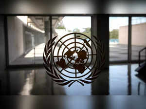 The United Nations logo is seen on a window in an empty hallway at United Nations headquarters