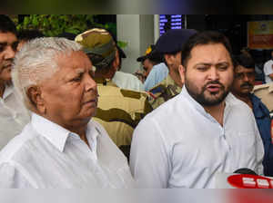 Patna: RJD chief Lalu Prasad along with Bihar Deputy CM Tejashwi Yadav speaks to...
