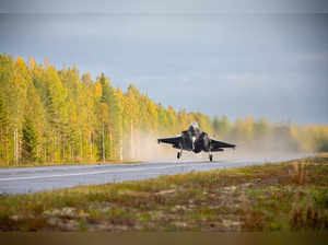 An F-35A Lockheed Martin fighter jet lands on a motorway, in Tervo