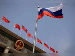 FILE PHOTO: The Russian national flag flies in front of the Great Hall of the People before a welcoming ceremony for Russian Prime Minister Mikhail Mishustin in Beijing