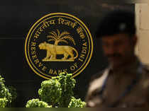 Rupee flat as likely RBI's dollar sales stave off move towards record low