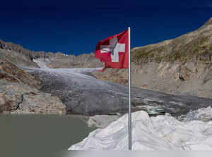 A Swiss flag is seen at the entrance of the ice cave on the Rhone glacier in Obergoms