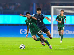 India's Narender Gahlot (C) fights for the ball with Saudi Arabia's Marran Mohammed Khalil (L) as they compete in the men's round of 16 football match during the 2022 Asian Games at the Huanglong Sports Centre Stadium in Hangzhou in China's eastern Zhejiang province on September 28, 2023.