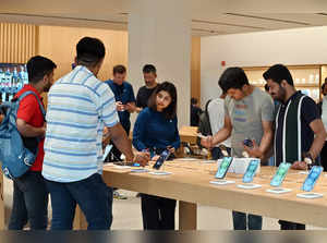 New Delhi, Sep 22 (ANI): Customers check out the newly-launched iPhone 15 smartp...