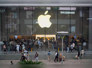 People walk past an Apple store in Shanghai