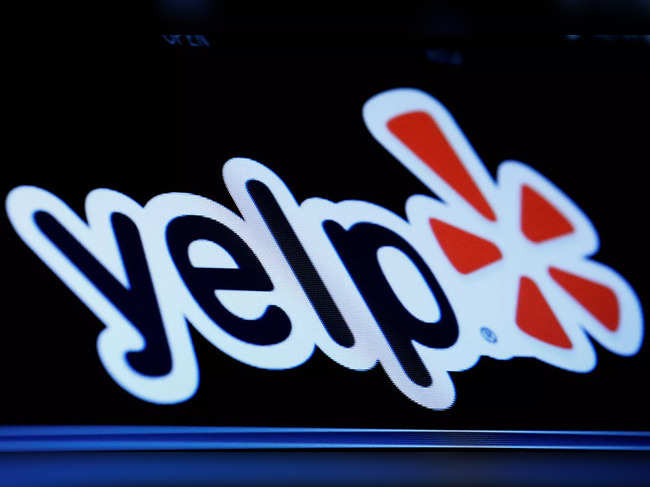 FILE PHOTO: The company logo for Yelp! is displayed on a screen on the floor of the NYSE