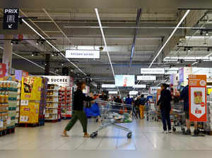 Customers shop in a supermarket near Paris