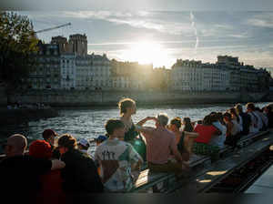 A bateau mouche tourism boat cruises on the Seine river with people on board in Paris on September 6, 2023.