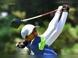 India's Aditi Ashok tees off from the 9th tee in round three of the women’s golf individual stroke play during the Tokyo 2020 Olympic Games at the Kasumigaseki Country Club in Kawagoe on August 6, 2021.