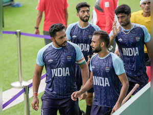 Hangzhou: Indian captain Harmanpreet Singh (L) with teammates after their win ag...