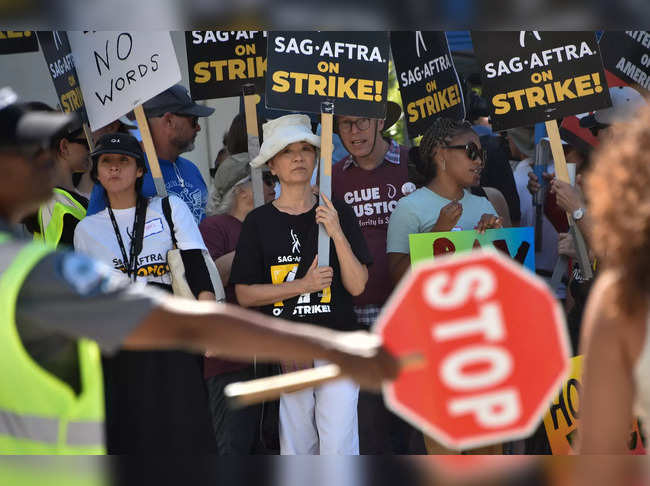 Members of the Screen Actors Guild (SAG-AFTRA) walk the picket line in front of Sony Pictures Entertainment Studios in Culver City, California, on August 29, 2023.