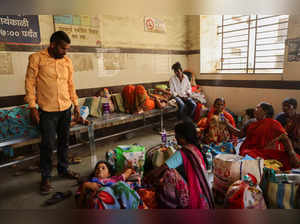 Relatives of patients admitted at the Shankarrao Chavan Government Medical College and Hospital are seen inside the hospital, in Nanded
