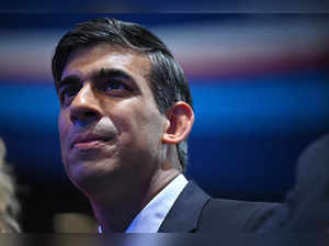 Britain's Prime Minister Rishi Sunak listens to a speaker address delegates at the annual Conservative Party Conference in Manchester, northern England, on October 2, 2023.