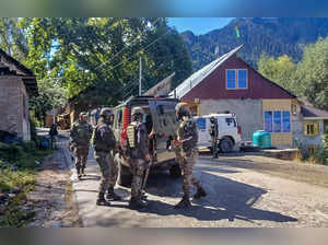Anantnag: Security personnel during a search operation at Kokernag area, in Anan...