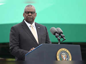 US Defense Secretary Lloyd Austin speaks during an Armed Forces Farewell Tribute in honor of General Mark Milley, 20th Chairman of the Joint Chiefs of Staff, and participates in an Armed Forces Hail in honor of General Charles Q. Brown, Jr., the 21st Chairman of the Joint Chiefs of Staff at Joint Base Myer-Henderson Hall in Arlington, Virginia, September 29, 2023.