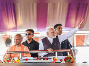 Varanasi, Sept 23 (ANI): Prime Minister Narendra Modi greets the crowd as he arr...