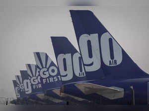 FILE PHOTO: The tail fins of Go First airline, formerly known as GoAir, passenger aircrafts are seen parked on the tarmac at the airport in New Delhi