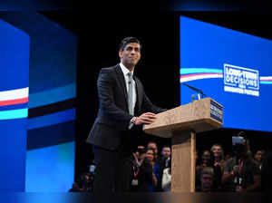 Britain's Prime Minister Rishi Sunak addresses delegates at the annual Conservative Party Conference in Manchester, northern England, on October 4, 2023.