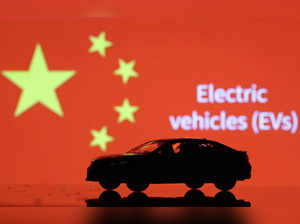 Illustration shows Car miniature, "Electric vechicles (EVs)" words and Chinese flag