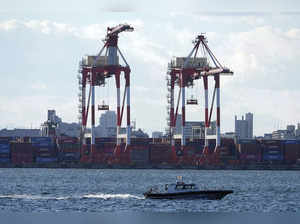 Tokyo: Gantry cranes sit idle at a container port Thursday, Jan. 20, 2022, in To...