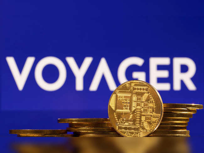 Illustration shows Voyager Digital logo and representations of cryptocurrencies