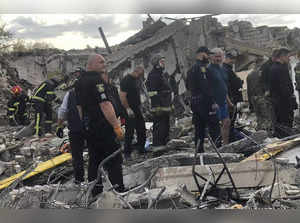 In this photo provided by the Ukrainian Police Press Office, emergency workers s...