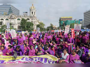 **EDS: CORRECTS DETAILS** Kolkata: ASHA workers stage a sits on a road during th...