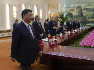 Chinese President Xi Jinping arrives for a bilateral meeting with US Senate Majority Leader Chuck Schumer and his delegation at the Great Hall of the People in Beijing on October 9, 2023.