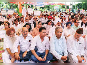 Jammu: Members of the opposition parties sit on dharna for the restoration of d...