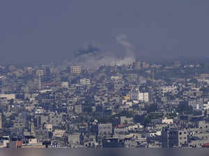 Smoke rises following an Israeli airstrike in Gaza City. The militant Hamas rule...