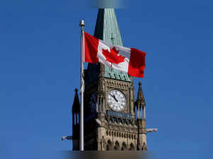 FILE PHOTO: FILE PHOTO: Canadian flag flies in front of the Peace Tower on Parliament Hill in Ottawa