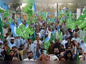 Supporters of Pakistan's Islamist political party Jamaat-e-Islami shout slogans as they wave the party's flags during a protest against the surge in petrol and electricity prices in Quetta on September 24, 2023.