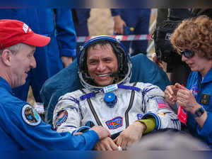 In this handout photograph taken and released by Roscosmos on September 27, 2023, Expedition 69 NASA astronaut Frank Rubio (C) of the International Space Station (ISS) crew is helped by specialists after his landing in the Soyuz MS-23 capsule in a remote area near the town of Dzhezkazgan, Kazakhstan.