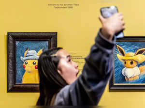 People look at paintings by artists inspired by the Pokemon at the Van Gogh museum in Amsterdam, on September 28, 2023.