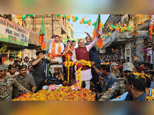 Bhopal: Madhya Pradesh Chief Minister Shivraj Singh Chouhan during a road show i...
