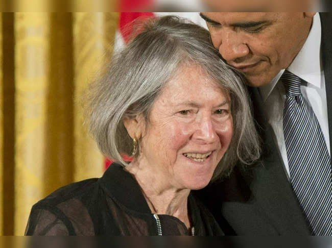 US President Barack Obama presents poet Louise Gluck with the 2015 National Humanities Medal during a ceremony in the East Room of the White House in Washington, DC, September 22, 2016.