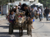 Gaza's desperate civilians flee or huddle in hopes of safety, as warnings of Israeli offensive mount