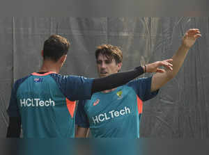 Chennai: Australia's captain Pat Cummins with teammate Mitchell Starc during a p...