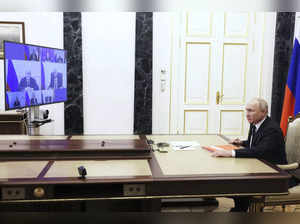 Russian President Vladimir Putin chairs a Security Council meeting via videoconf...